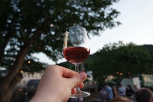 hand-holding-wine-glass-in-the-wine-tasting temecula during a limousine service from city captain in san diego