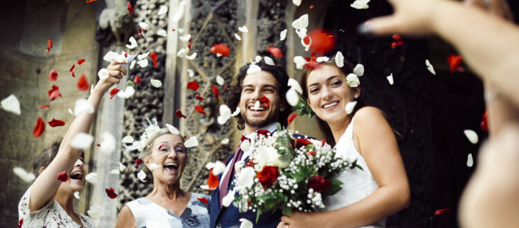 Family throwing rose petals at the newly wed bride and groom in La Jolla, San Diego, Carlsbad Wedding.