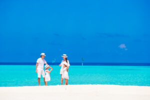 Happy beautiful family on beach during summer vacation