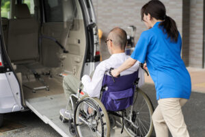 A caregiver who puts an elderly person in wheelchair accessible van in San Diego, ca for doctors appointments...