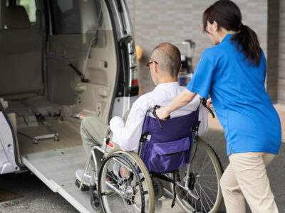 A caregiver who puts an elderly person in wheelchair accessible van in San Diego, ca for doctors appointments...