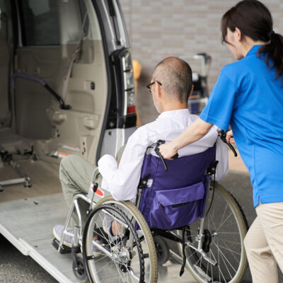 A caregiver who puts an elderly person in wheelchair accessible van in San Diego, ca for doctors appointments...